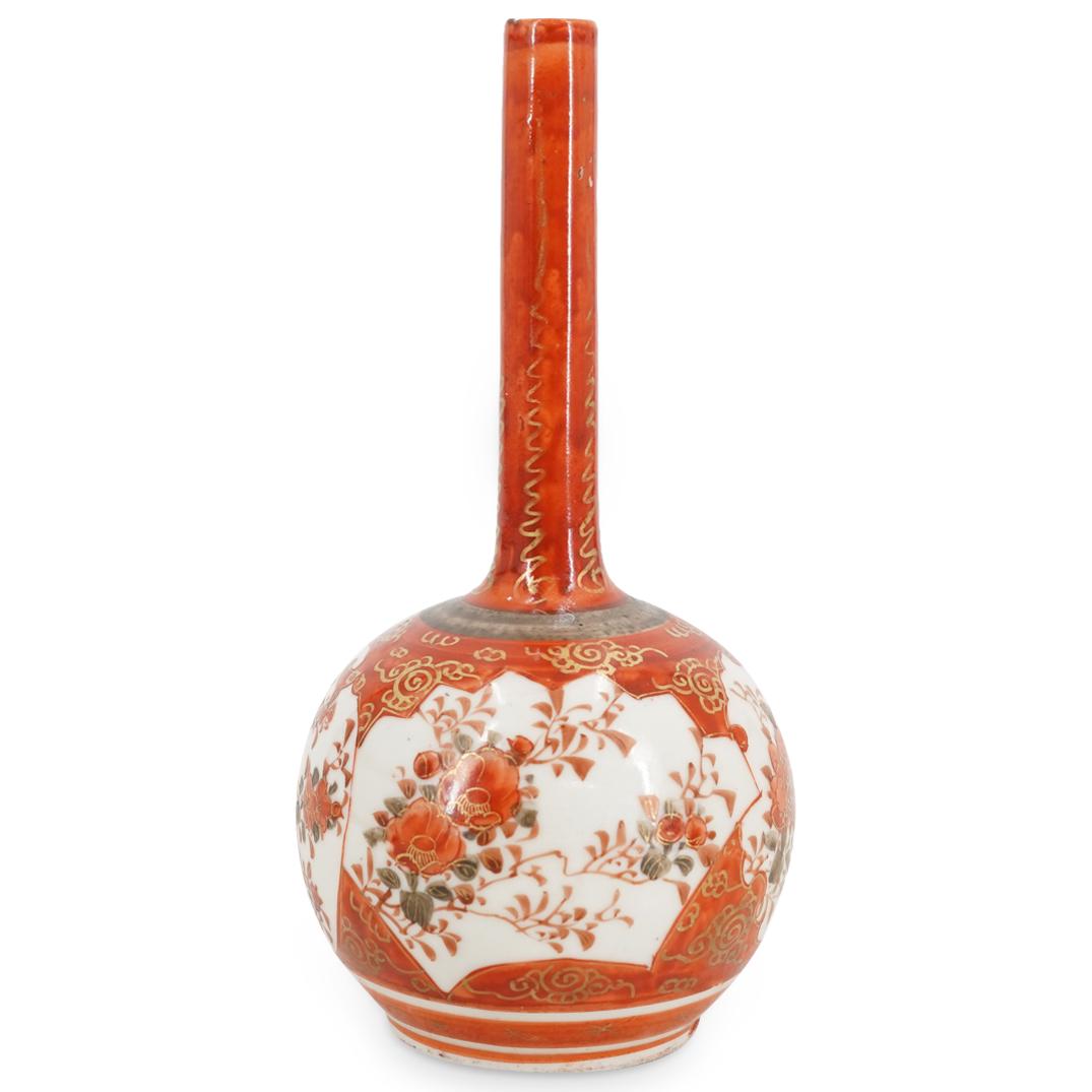 Antique Kutani Imari Floral Porcelain Vase: DESCRIPTION: Antique Kutani imari long neck porcelain bud vase enameled with vermillion and gold tones throughout and presenting depictions of flowers as well as cloud motifs at the shoulder. Kutani h