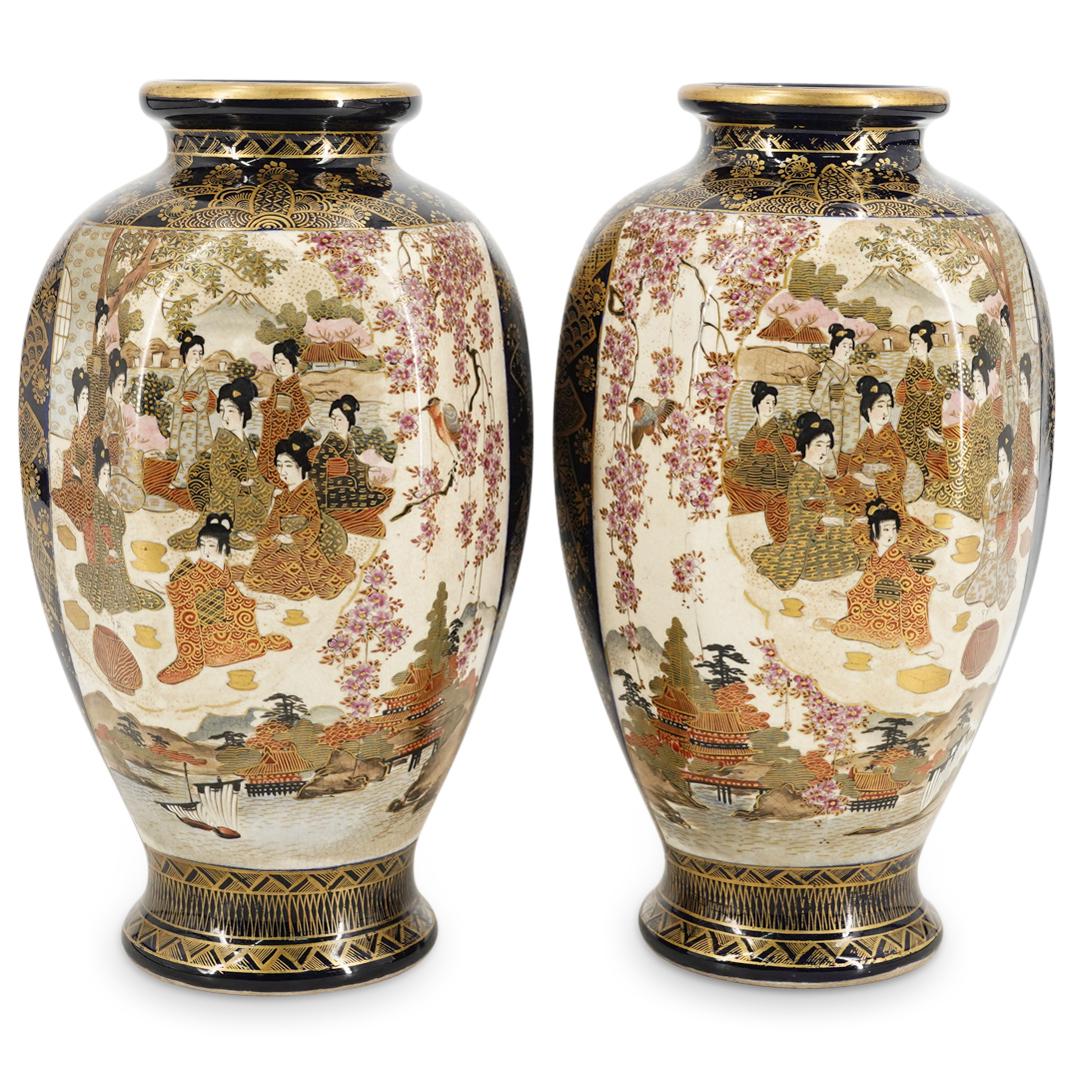 Pair Of Antique Satsuma Takeuchi Porcelain Vases: DESCRIPTION: Two matching and partially mirrored Satsuma vases, each featuring two images-one of women in a domestic setting, one of women in a garden setting-each framed by gilt borders and surrounde