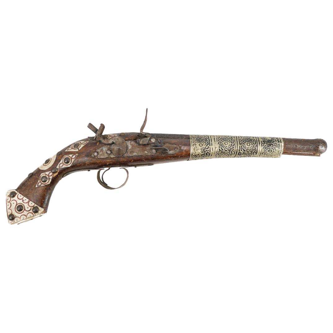 Antique Moroccan Flintlock Pistol with Bone: DESCRIPTION: Antique Moroccan flintlock pistol featuring inlaid geometric designs out of bone at the handle, overlaid at the triangular pommel as well as opposite the lock plate with further details e