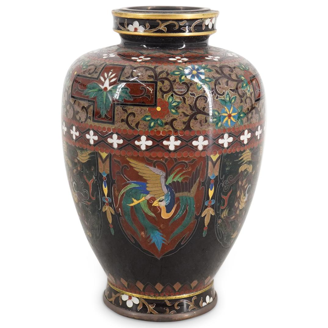 Antique Japanese Miniature Cloisonne Vase: DESCRIPTION: Antique miniature cloisonne vase featuring a pattern of crests decorated with dragon and fenghuang (Chinese phoenix) motifs. Embellished with floral and foliage patterns and motifs around