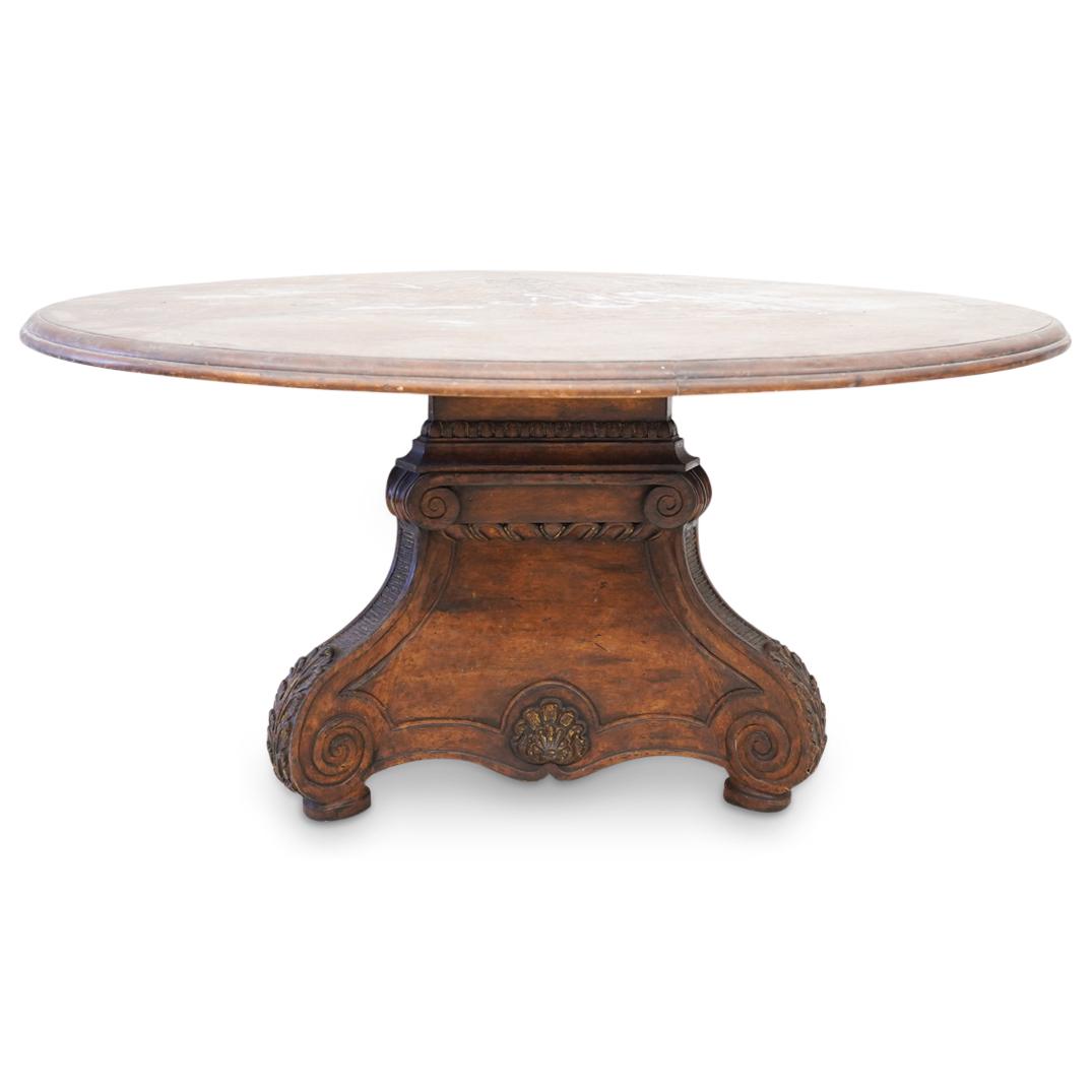 Antique Baroque Italian Carved Foyer Table: DESCRIPTION: An antique Baroque Italian carved wood foyer table. Features a circular beveled top with triangular formed, foliate and shell crest carved base. CIRCA: 19th Century ORIGIN: Italy DIMENSIO