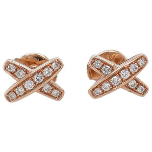 Chaumet 18k Gold & Diamond Earrings: DESCRIPTION: A pair of Chaumet earrings comprised of 18k rose gold foundation featuring in a crossed design, decorated with Diamond insets. Stamped along the back "Chaumet 750" With Serial "728390".