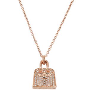 Hermes 18K Rose Gold Diamond Kelly Amulette Pendant Necklace: DESCRIPTION: Hermes 18K Rose Gold Diamond Kelly Amulette Pendant Necklace, features a diamond encrusted Kelly bag pendant, completed with a lock and key form closure. Stamped along the underside of