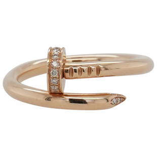 Cartier 18k Rose Gold and Diamond Nail Ring: DESCRIPTION: A Cartier nail ring composed of an 18k Rose gold foundation accented along the nail head and tip with Diamond insets. Stamped along the interior band "Cartier 750" and "x2883". Total Weig