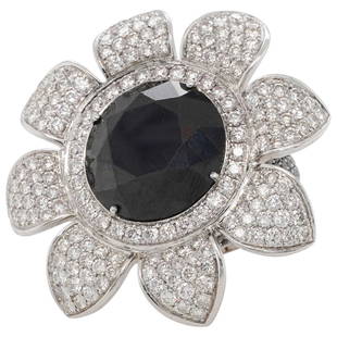 Grimoldi 18k Gold, Onyx and Diamond Floral Ring: DESCRIPTION: An 18k white gold floral form ring garnished by a series of pave diamonds amounting to approx. 4cts total, centered by a round cut Onyx stone. The band further decorated with round cut