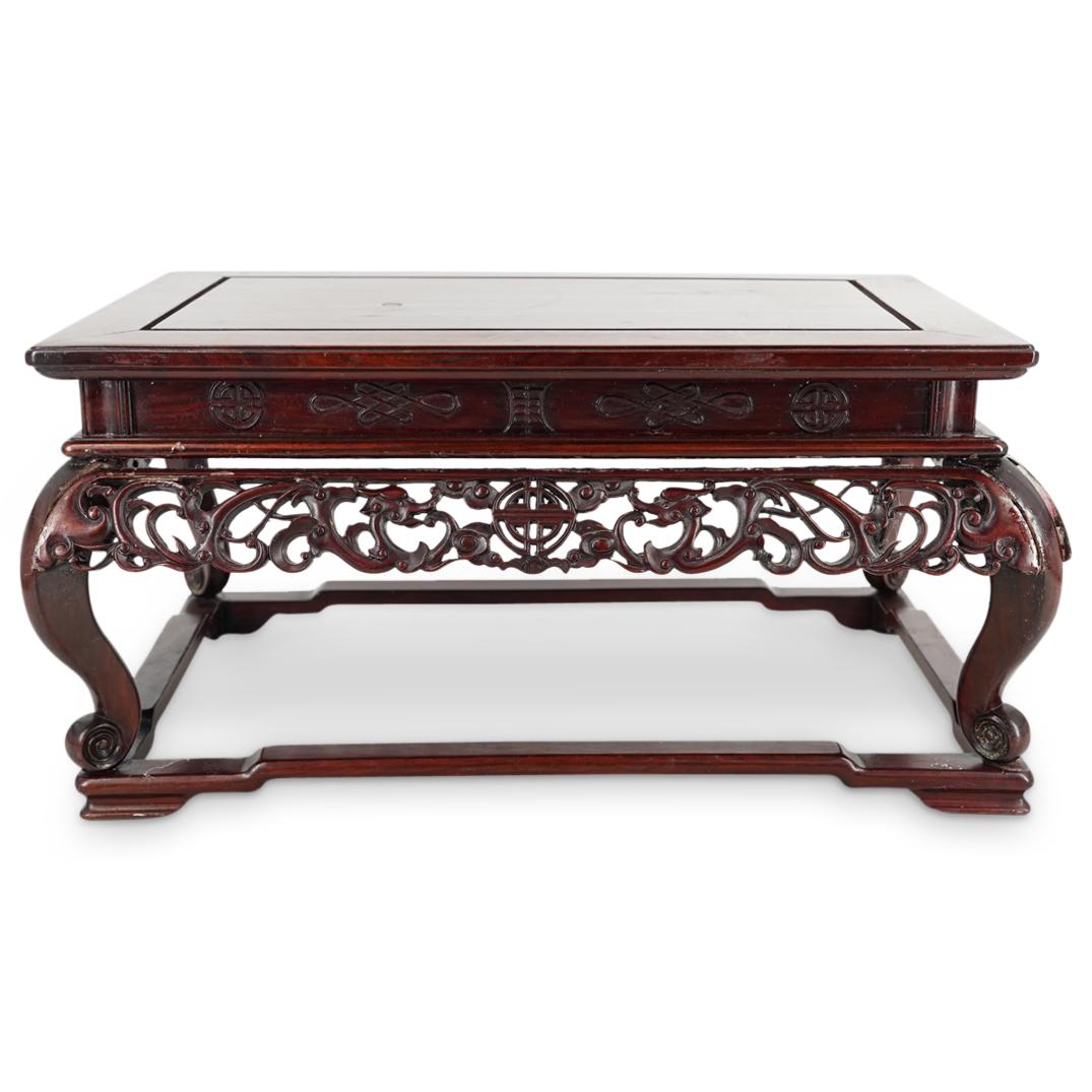 Antique Chinese Wood Carved Bonsai Stand: DESCRIPTION: An antique Chinese wood carved bonsai stand with rectangular form, scrolling openwork skirt, and linear stretcher. CIRCA: 20th Cent. ORIGIN: China DIMENSIONS: H: 6" x W: 12" x L: 18" Have