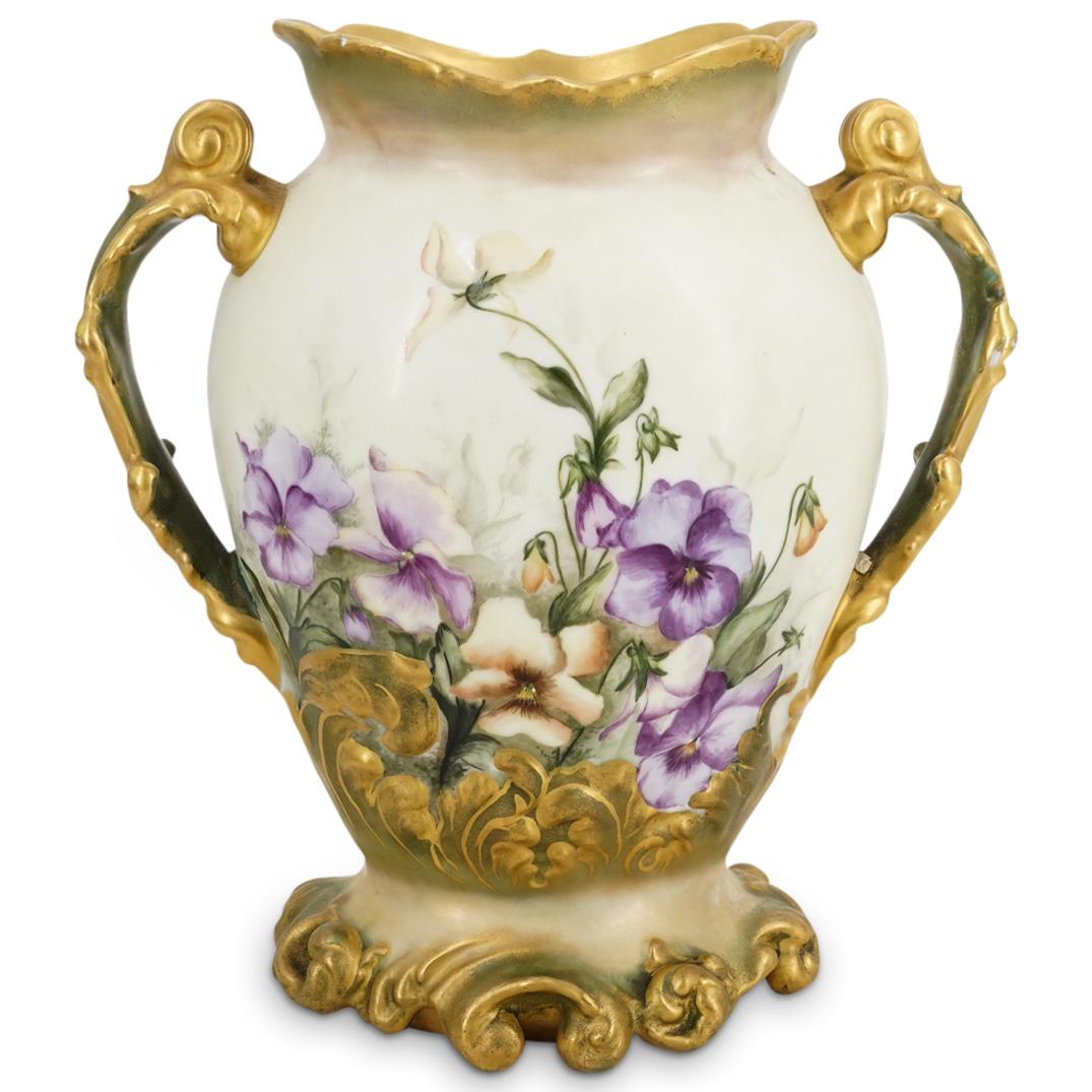 Antique Jean Pouyat Limoges Parcel Gilt Vase: DESCRIPTION: Antique porcelain vase from Jean Pouyat Limoges featuring parcel double foliate scroll handles accompanied by a naturalistic gilt scroll designed foot, a gilt rim and vibrant enameled dep