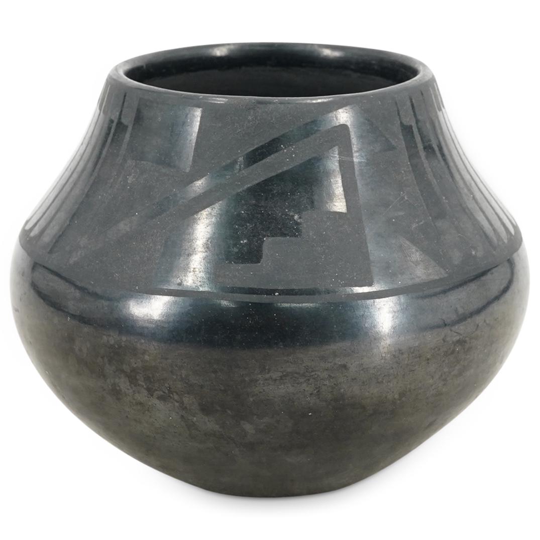 Maria And Santana Martinez (1887-1980 / 1909-2002) Pottery: DESCRIPTION: Marie and Santana Martinez pottery vessel from San Ildefonso Pueblo featuring geometric and feather-like marks around the lip. Signed on underside "Marie + Santana". Includes postcard wit
