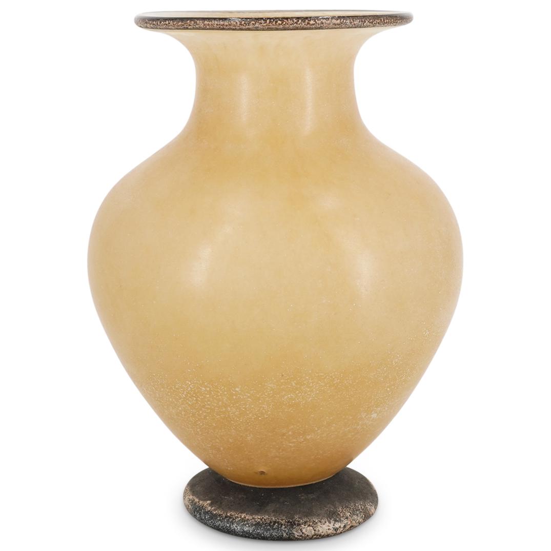 Signed Vintage Art Glass Bulbous Vase: DESCRIPTION: Art glass bulbous vase featuring a cream color throughout accented by brown shade accents on lip and foot. Signed on underside. CIRCA: 20th Century DIMENSIONS: H: 15" D: 10.75" Have a sim