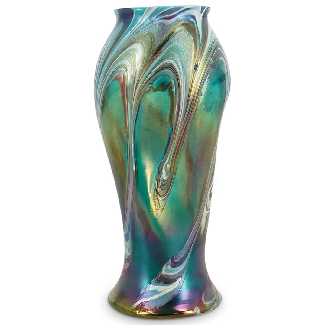 Loetz Iridescent Glass Vase: DESCRIPTION: Loetz iridescent footed glass vase comprising of three dimples at the twisted body, a flanged mouth, colorful undulating bands emerging from the upper portion and completed by a polished