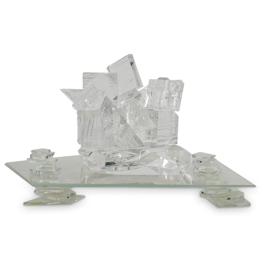 Modernist Clear Glass & Lucite Sculpture: DESCRIPTION: A modernist clear glass and lucite dimensional sculpture designed as an assembly collection of lucite cubes atop an irregular pentagon glass stand tray that is supported by lucite blocks.