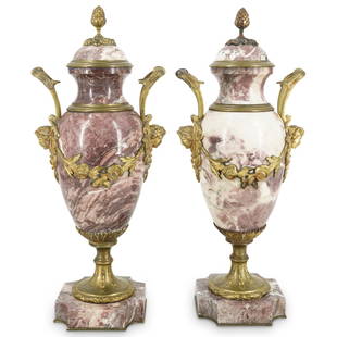 Pair of Rouge Marble Bronze Mounted Cassolettes: DESCRIPTION: Pair of Rouge Marble cassolettes with gilt bronze mounted design features double handles, figural masks, and hanging rose wreath details. CIRCA: Early 20th Cent. ORIGIN: France 