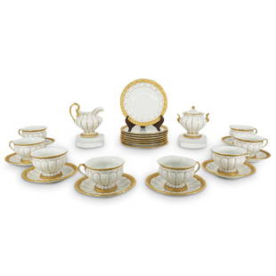 (26Pc) Meissen Parcel Gilt Porcelain Service Set: DESCRIPTION: (26Pc) Meissen porcelain service set featuring parcel gilt rims and feet with scroll as well as leaf depictions in relief, petal designs around with gilt bands at the valleys, and parcel