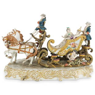 Antique Meissen Porcelain Carriage Grouping: DESCRIPTION: Meissen porcelain grouping depicting a scene of two ladies riding in a horse-drawn sleigh attended by coachmen. Each figure wears an outfit involving delicately crafted lace components an