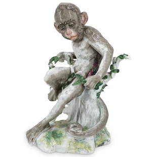 19th Century Fine German Porcelain Monkey: DESCRIPTION: Large 19th Century fine German porcelain monkey with hand painted naturalistic detail, posed sitting on a tree stump with tail curled. Underglaze blue scepter mark at base edge. CIRCA: