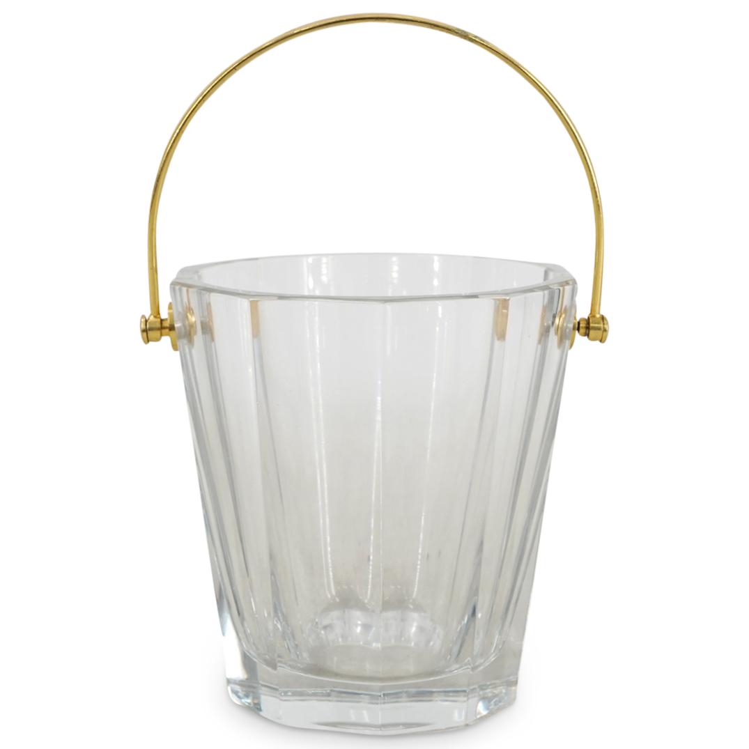 Baccarat Crystal Ice Bucket: DESCRIPTION: A Baccarat crystal ice bucket with faceted design and gilt bronze handle. Baccarat acid stamp at underside. CIRCA: 20th Cent. ORIGIN: France DIMENSIONS: H: 6" x D: 6" Have a similar item 