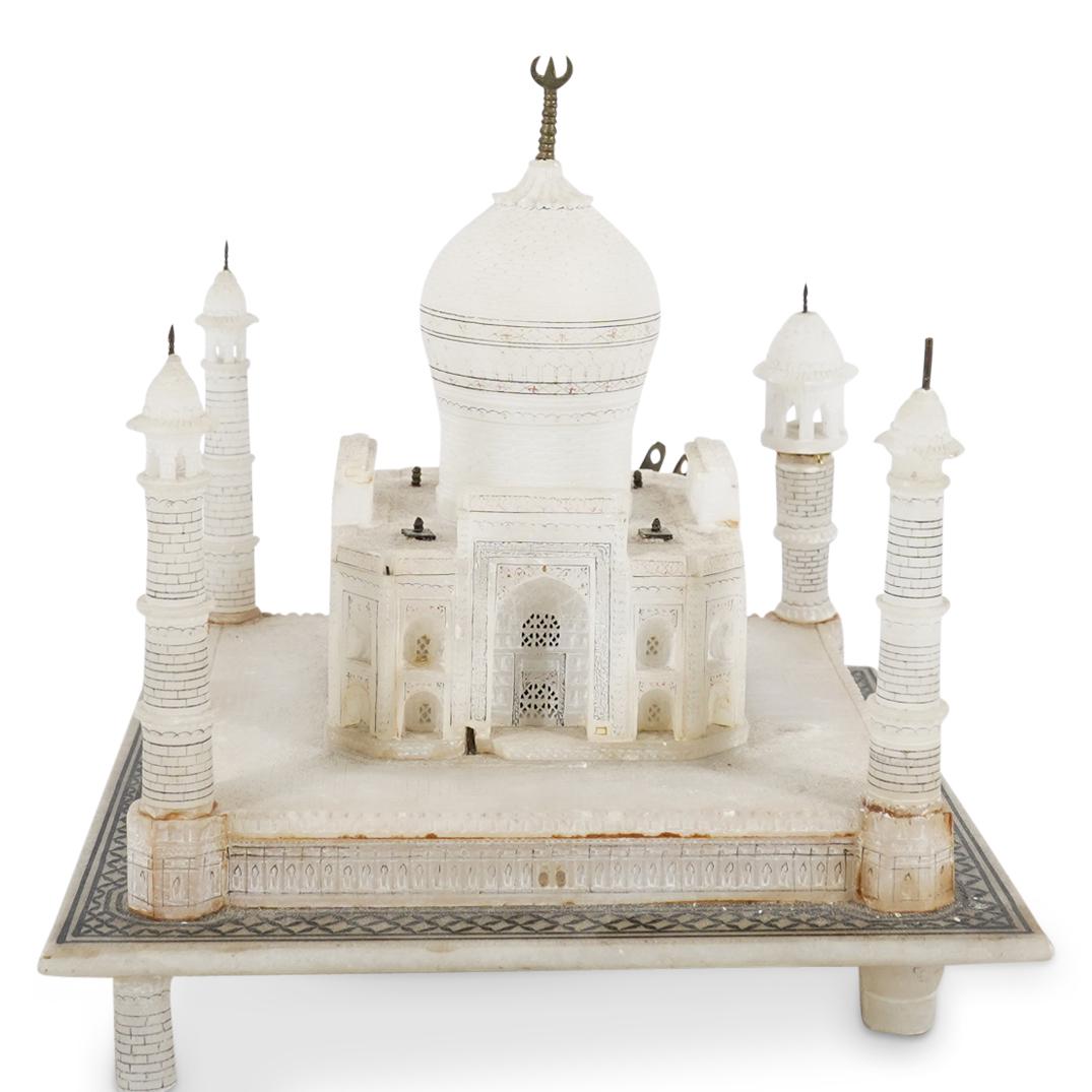 Vintage Carved Alabaster Taj Mahal Lamp: DESCRIPTION: Vintage Taj Mahal table lamp carved out of alabaster presenting painted black details throughout and four feet. CIRCA: Mid 20th Century ORIGIN: India DIMENSIONS: H: 7.25" W: 7" L: 7" Have