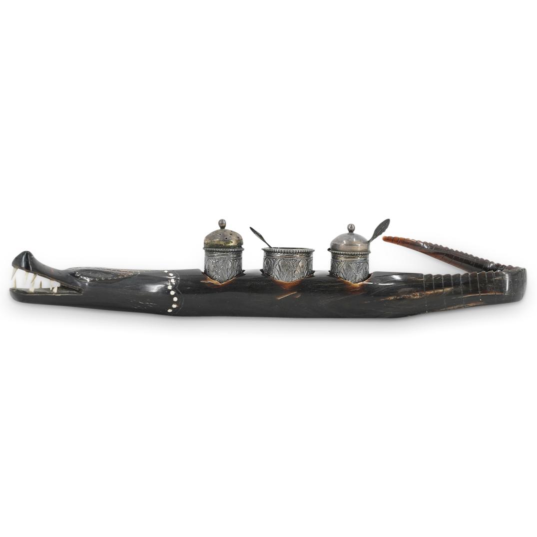 Peruvian Carved Horn Alligator & Silver Plated Salt Cellars: DESCRIPTION: Antique Peruvian carved horn alligator presenting details of white teeth, incised details of scales at the tail and head, and three open areas at the topside housing silver plated salt ce