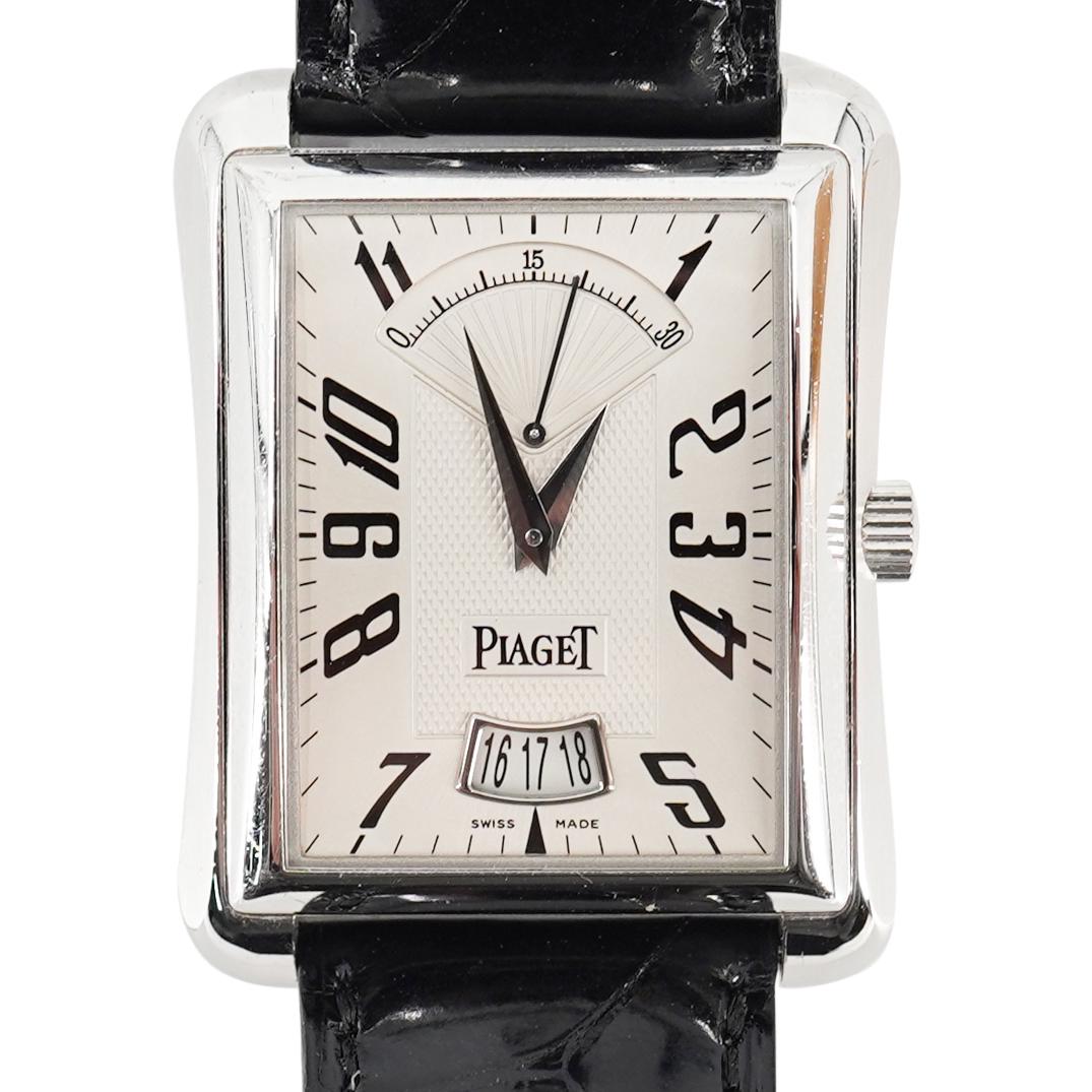 Piaget Emperador 18k Gold Watch: DESCRIPTION: STRAP: A Piaget Featuring a Black crocodile leather with 18K white gold, Piaget pin buckle, DIAL: Silver, MOVEMENT: Automatic, CALIBRE: 560P, FUNCTIONS: Date, 30-Second retrograde. Refere
