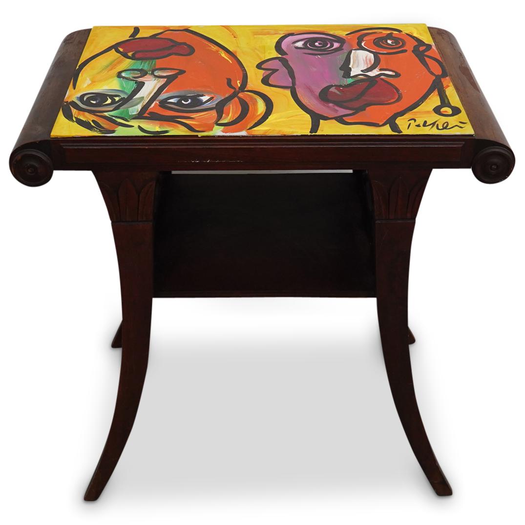 Peter Keil (B. 1942) Oil On Table: DESCRIPTION: Side table featuring an oil painting on its top by Peter Keil depicting two highly stylized, polychrome faces with exaggerated features. Table is embellished with scroll form edges on two