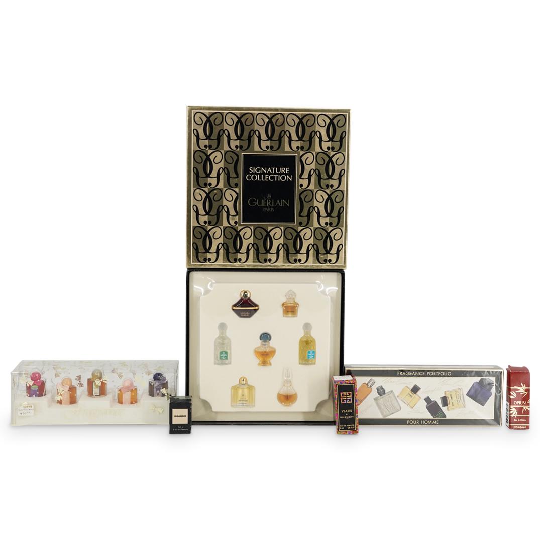 (6 Pc) French Perfume Bottles And Sampler Boxes: DESCRIPTION: Six boxes of mostly if not completely unused perfumes including three boxes of individual bottles-one Ysatis de Givenchy, one Jil Sander No 4, one "Opium" by Yves Saint Laurent-and three