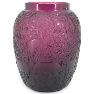 Lalique Biches Purple Amethyst Glass Vase: DESCRIPTION: Lalique Biches amethyst glass vase featuring a shouldered design decorated on the side with raised, textured designs depicting deer among foliage. Sticker on lip and incision on