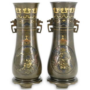 Pair of Japanese Bronze Meiji Vases: DESCRIPTION: A pair of Japanese Meiji period vases composed of bronze with inlaid gold accented wiseman in landscape and floral designs, completed with double handles at neck. Character markings at