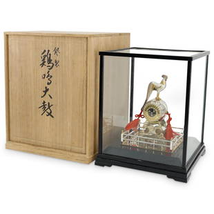 Japanese Sterling Silver Rooster & Drum: DESCRIPTION: Japanese sterling silver rooster on drum statue, complete in glass panel display case, with original box create. Crate marked with Japanese characters and stamps. CIRCA: Early to Mid.