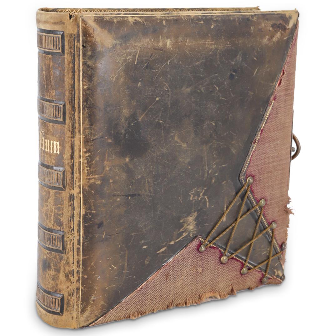 Antique Victorian Leather Photo Album: DESCRIPTION: An antique Victorian leather, canvas and brass photo album. With hand-engraved inscription on verso that reads: "Janet, Julian, Ana and Greg. 1969". CIRCA: Late 19th Century DIMENSIONS: H