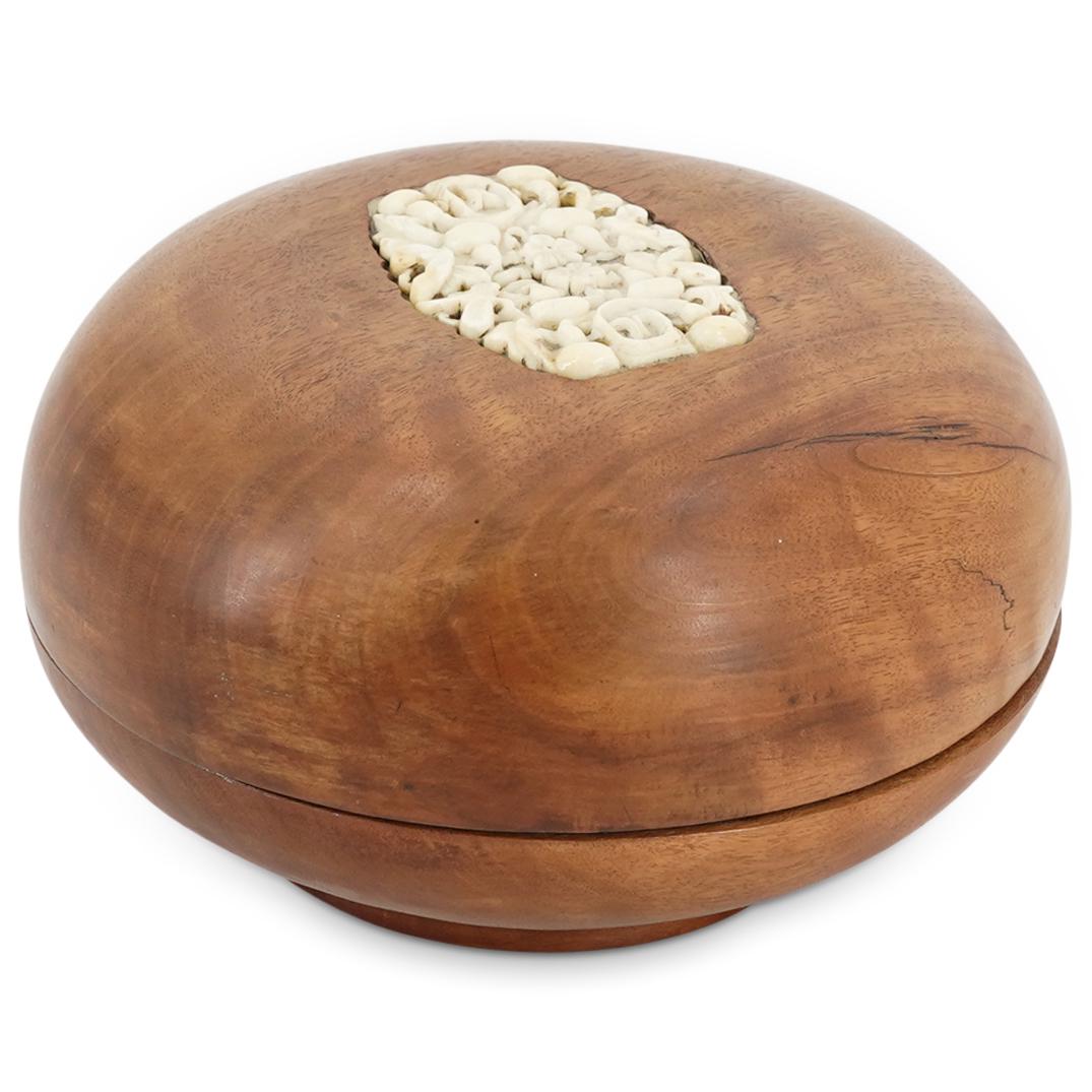 Antique Chinese Round Wooden Box With Open Work Bone Inset: DESCRIPTION: Carved wood, round, lidded box featuring a carved, open-work, bone inset in its lid. Inset is decorated with floral and foliage designs throughout. CIRCA: 20th Century ORIGIN: China DIMEN