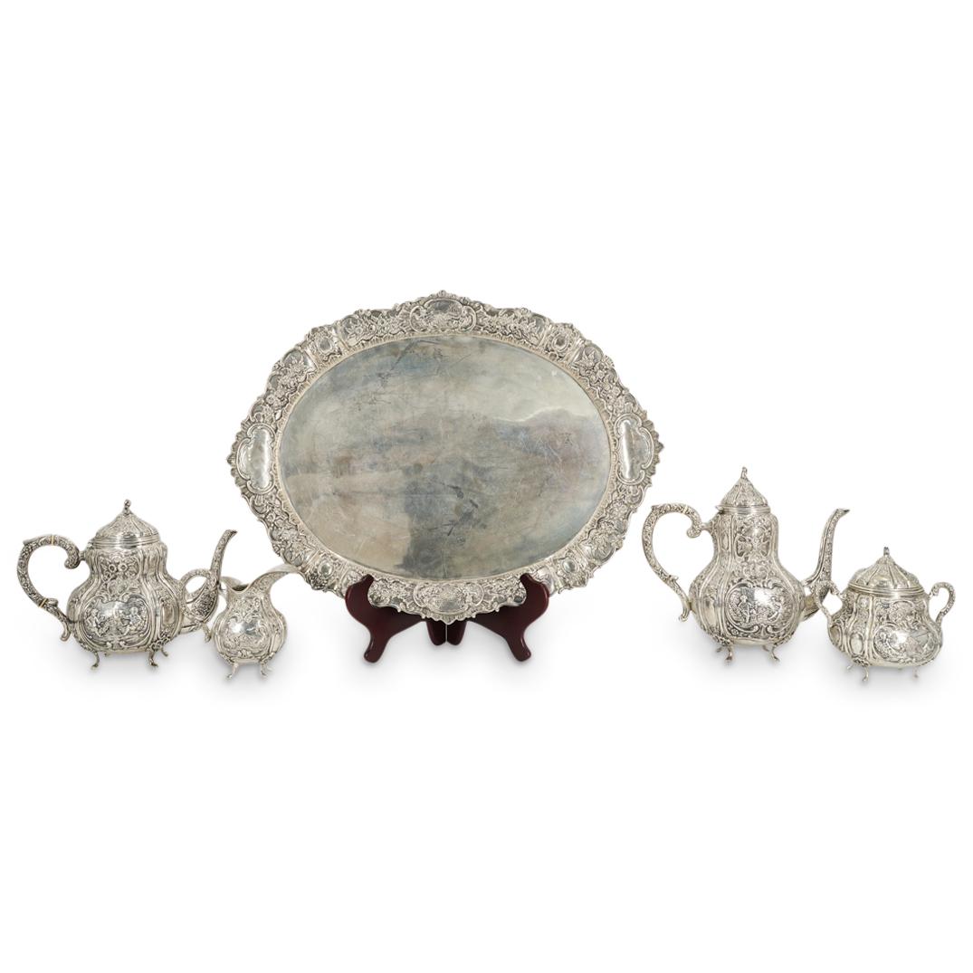 (5Pc) Antique French 900 Silver Tea Set: DESCRIPTION: (5Pc) Antique French 900 silver tea set featuring ornate flower and scroll designs in high relief throughout along with varying depictions of putti in repose with goblets. Impressed at th