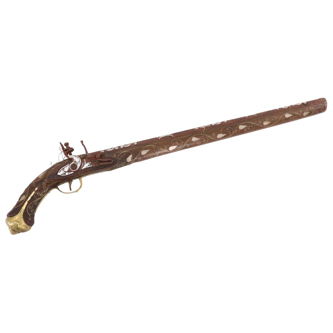 Antique Ottoman Silver & Mother of Pearl Flintlock Pistol: DESCRIPTION: Antique Ottoman flintlock pistol featuring overlaid brass with foliage designs in relief at the butt, and handguard, completed by inlaid silver forming scroll and wave designs throughout 
