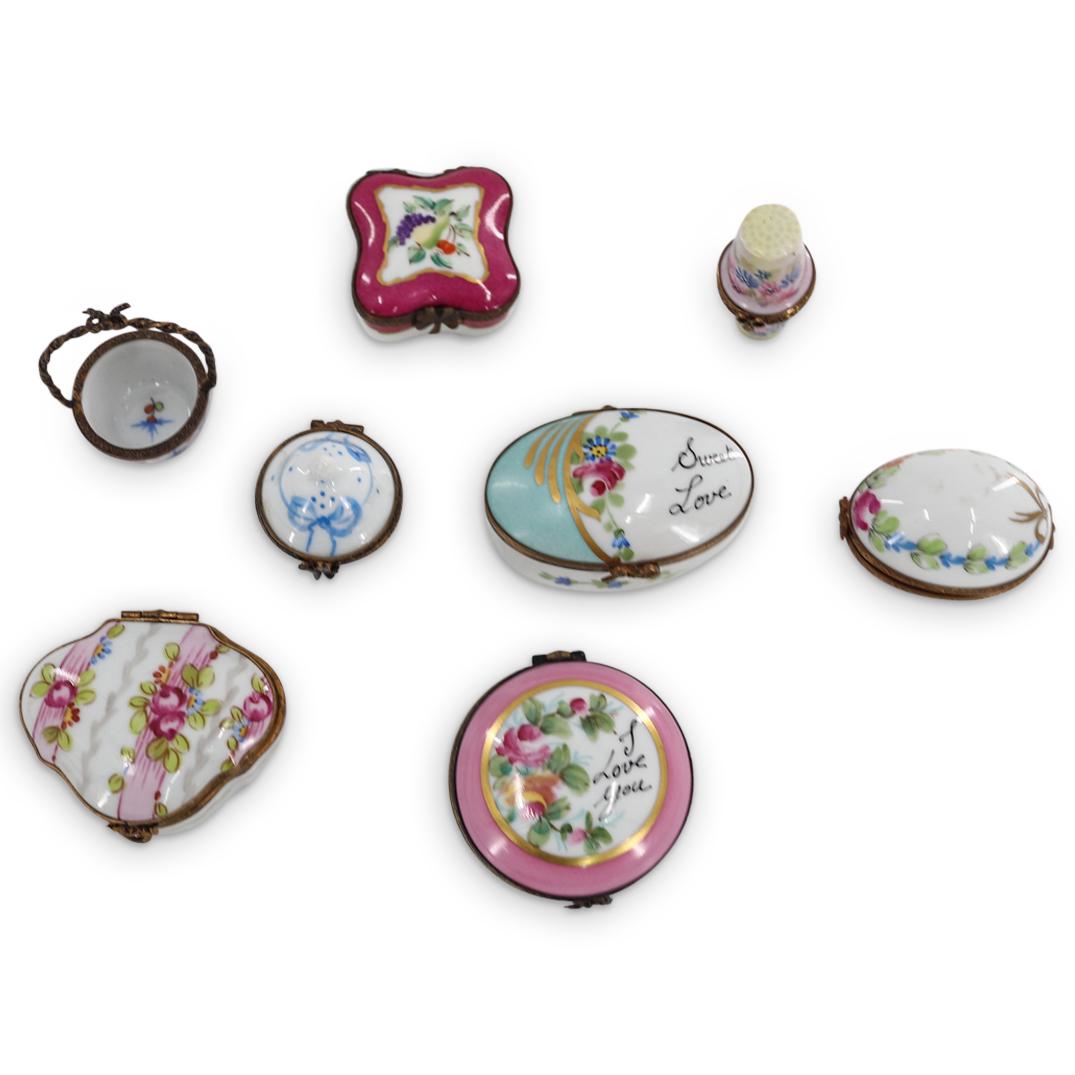 (8 Pc) Limoges Porcelain Pill And Thimble Vessels: DESCRIPTION: Eight Limoges porcelain vessels, each featuring gilt bronze trimmings. One vessel features a thimble form body and lid, one vessel is an open basket, and all other vessels feature a body 