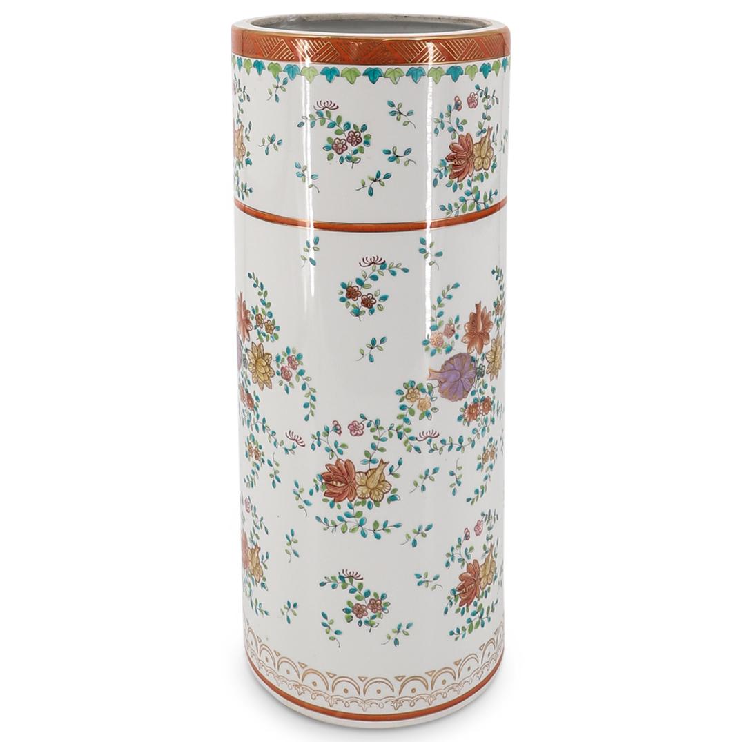 Probably Chelsea Porcelain Chinoiserie Umbrella Stand: DESCRIPTION: Chinoiserie porcelain umbrella stand featuring polychrome floral and foliage motifs on side and embellished with gilt and orange geometric and foliage patterns at foot and lip. Marked on 