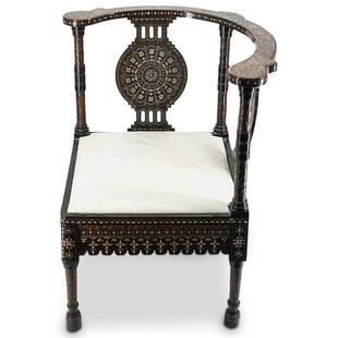 Carlo Bugatti (Italian 1856-1940) Corner Chair: DESCRIPTION: Carlo Bugatti (Italian 1856-1940) Corner chair with Orientalist applied and inlaid mahogany and walnut foundation with vellum seat. Finished with heavily inlaid backrest, raised on four t