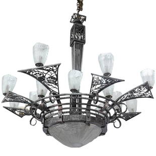 Possibly Edgar Brandt 16-Light Silvered Iron Chandelier: DESCRIPTION: Possibly Edgar Brandt silvered iron chandelier with (16) light outlets, features open-work scrolling floral detail frame, and flared arms holding molded glass shades with staggered