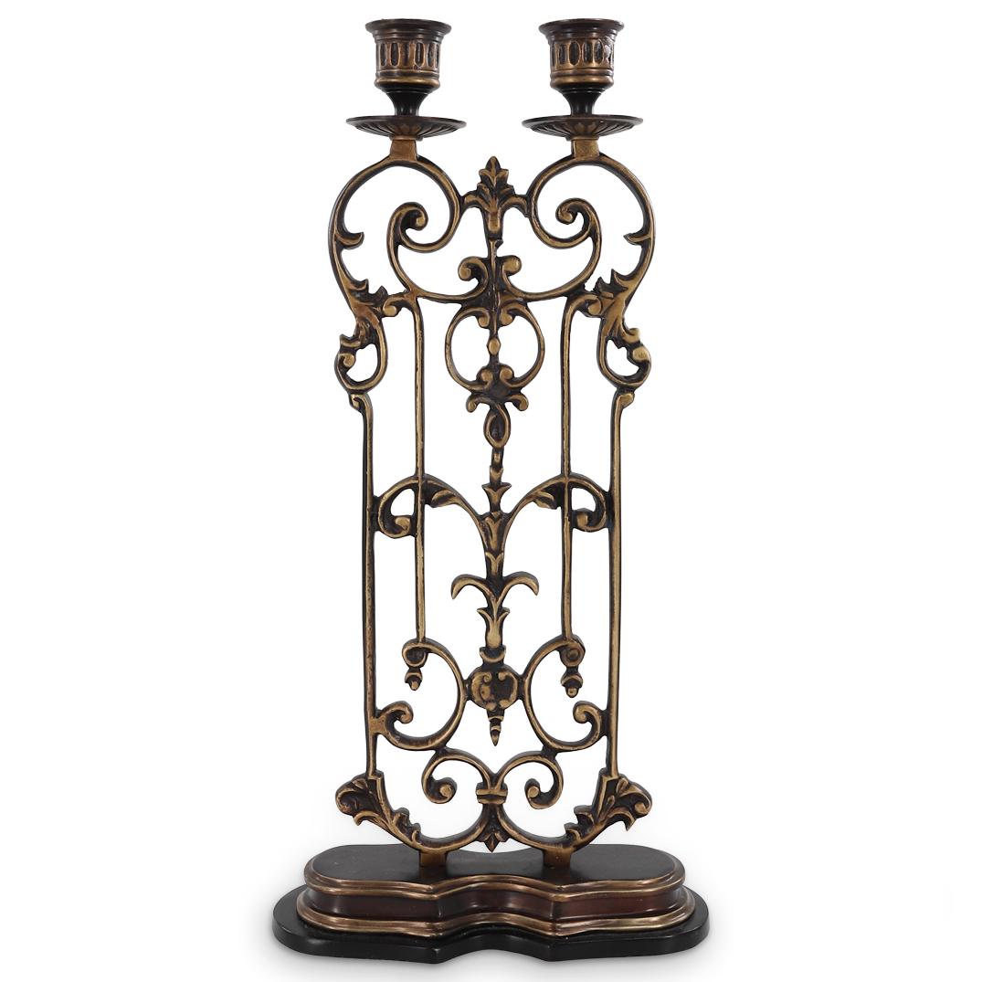 Antique French Bronze Candelabra: DESCRIPTION: Bronze Candelabra featuring two candle sockets atop open-work swirling foliage designs. CIRCA: Late 19th to early 20th Century ORIGIN: France DIMENSIONS: H: 17.25" W: 3.75" L: 8.75" Prove