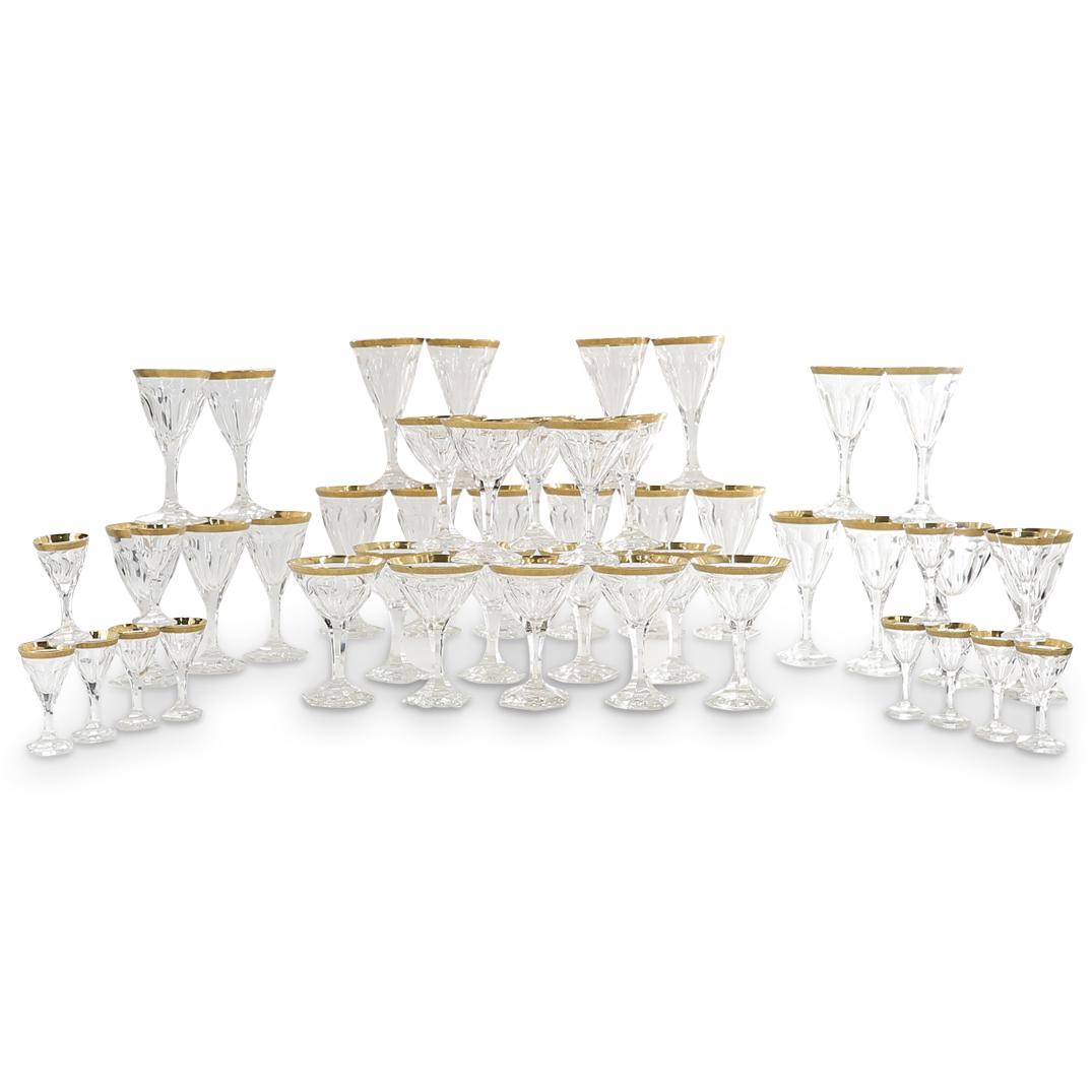 (47 Pc) French Gilt Rimmed Stemware Set: DESCRIPTION: 47 piece stemware set featuring sherry glasses, cocktail glasses, white wine glasses, water glasses, and ribbed white wine glasses, each featuring a matching gilt accent around its rim. A