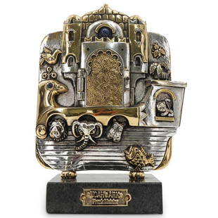 Frank Meisler (Israeli, 1929â€“2018) "Noahs Ark" Gold & Silver Plated Metal Sculpture: DESCRIPTION: Gold and silver plated metal sculpture by Israeli artist Frank Meisler (1929-2018) titled "Noah's Ark"; Depicting a boat with animals in relief and a hinged door revealing Noah standing