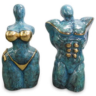 Pair of Mid Century Patinated Bronze Torso Sculptures: DESCRIPTION: Pair of Mid Century bronze sculptures depicting exaggerated forms of a man and woman's torso with parcel gilt details of muscles and a bikini completed by a blue patinated tone