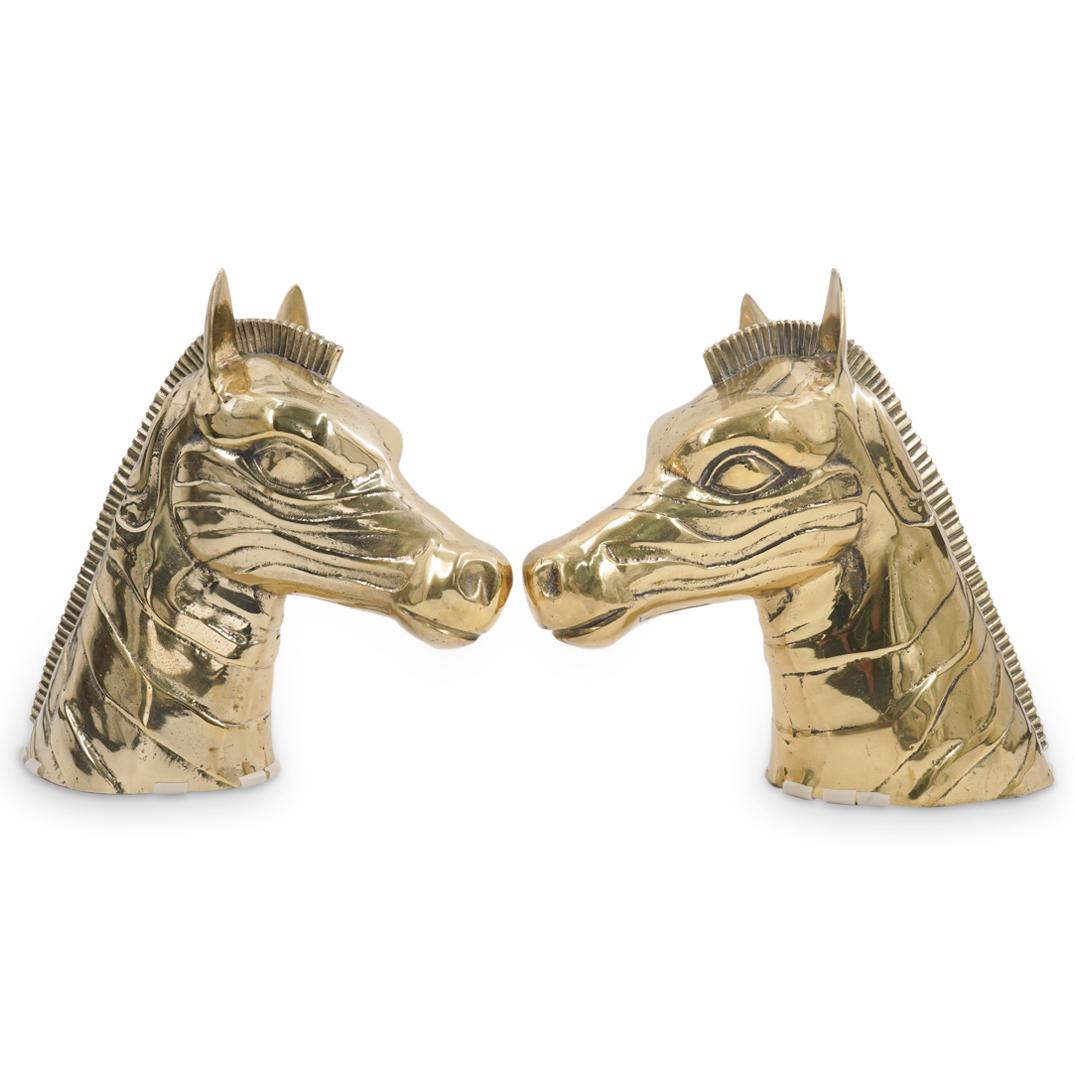 Pair Of Gilt Bronze Zebra Heads: DESCRIPTION: Two matching gilt bronze sculptures, each depicting a zebra's head with a narrow mane and piercing gaze. CIRCA: 20th Century ORIGIN: Continental DIMENSIONS: H: 11.75" W: 4.5" L: 13.25" Ha