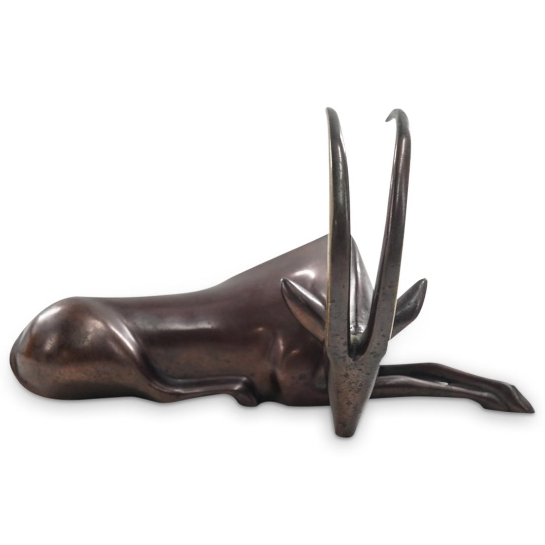 Limited Edition Loet Vanderveen Gazelle Bronze Sculpture: DESCRIPTION: A Limited edition Loet Vanderveen (American/Dutch, 1921-2015) Gazelle bronze sculpture in a seated stretching pose. Designed with elegant satin polished surface and mahogany-colored patin