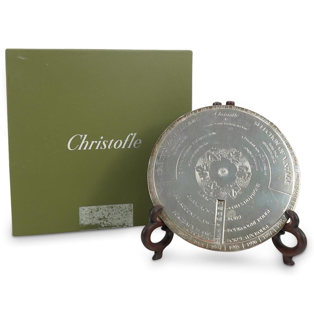 Christofle Silver Plated Oenologie Disque in Box: DESCRIPTION: Christofle silver plated oenologie disque; One disc rotating atop the other each impressed with script and numerals as well as foliage at the center of the top disc. A wine and champagne