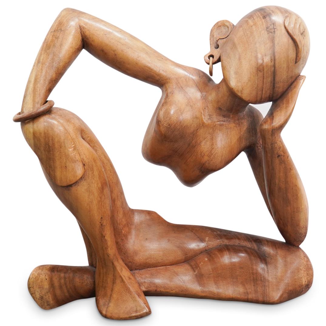 Large Indonesian Carved Wood Abstract Pensive Girl Sculpture: DESCRIPTION: Carved wood sculpture depicting a girl seated with crossed legs and resting her left elbow and her right hand on her knees. Piece is fashioned of one piece without a torso below the rib c