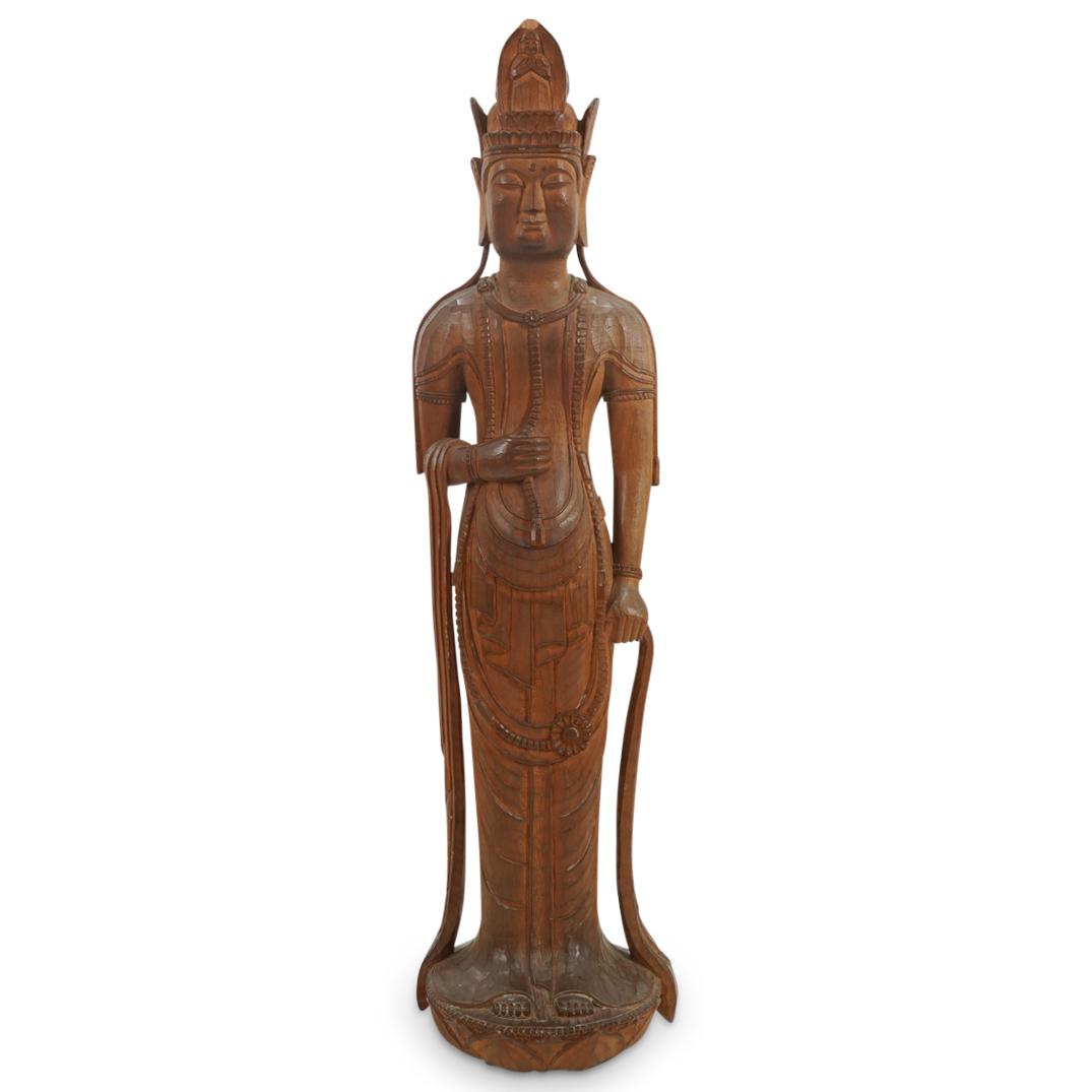Antique Chinese Carved Wood Standing Buddha: DESCRIPTION: Carved wooden sculpture depicting Gautama Buddha wearing a headdress ornamented with a meditating figure in front of his ushnisha (top knot). Figure is adorned with necklaces and is sculp