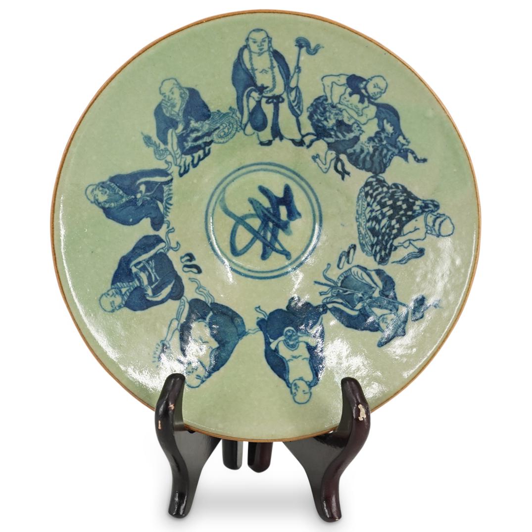 Antique Chinese Blue & White Porcelain Bowl: DESCRIPTION: Antique Chinese glazed blue and white footed porcelain bowl decorated with taoist religious figures in the well and around the exterior over a pale green ground. Han characters at the und