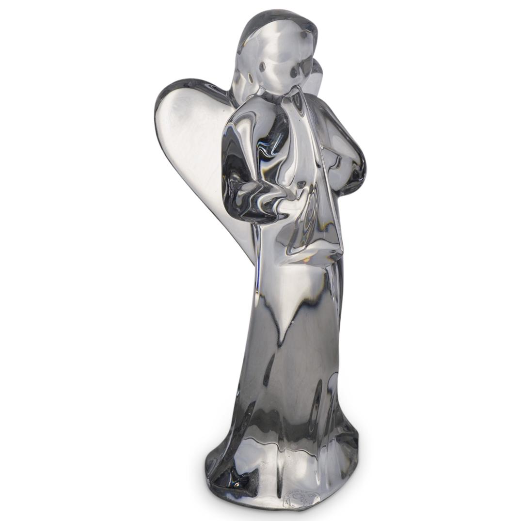 Baccarat Crystal "Angel W/ Trumpet" Figurine: DESCRIPTION: A Baccarat crystal "Angel with Trumpet" figurine in clear translucent color. Marked with the Baccarat stamp on the underside. CIRCA: 20th Century ORIGIN: France DIMENSIONS: H: 6" Have a s