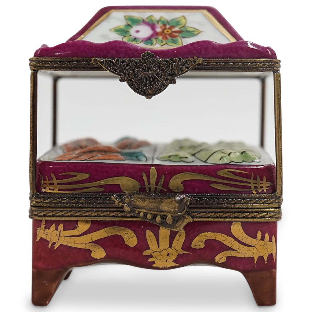 Limoges Porcelain Painted "Vegetable Cart" Trinket Box: DESCRIPTION: A Limoges porcelain trinket box depicting a farmers market vegetable cart. Marked on the underside with "Limoges France Peint Main" signature hallmarks, and artist initials A.L. CIRCA: 20