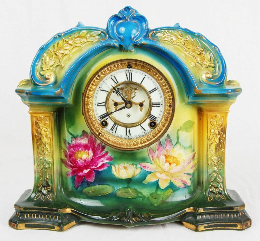 Ansonia clock with royal bonn porcelain: Ansonia clock with royal bonn German porcelain. Stamped. Circa 1920s. Works perfectly. H:12.5" W:13.5"