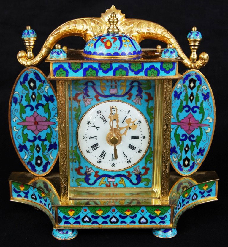 Chinese cloisonne clock: Chinese cloisonne clock with hand painted porcelain on the sides. Stamped Republique of China. Circa 1950s-1970s. H:8" W:8.5"